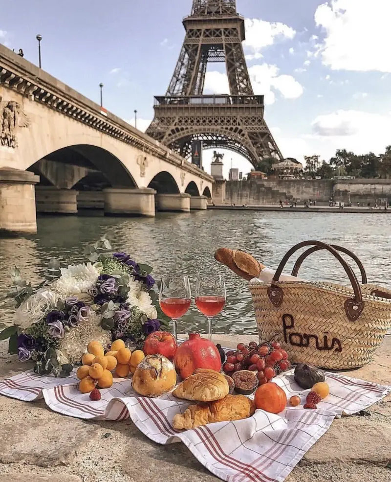 Summer picnic by the Seine with Eiffel Tower backdrop
