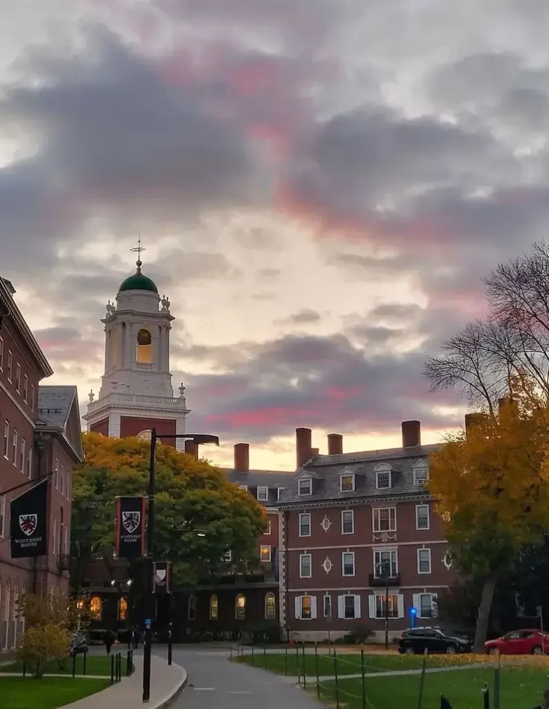 Sunset over Harvard University with autumn trees.