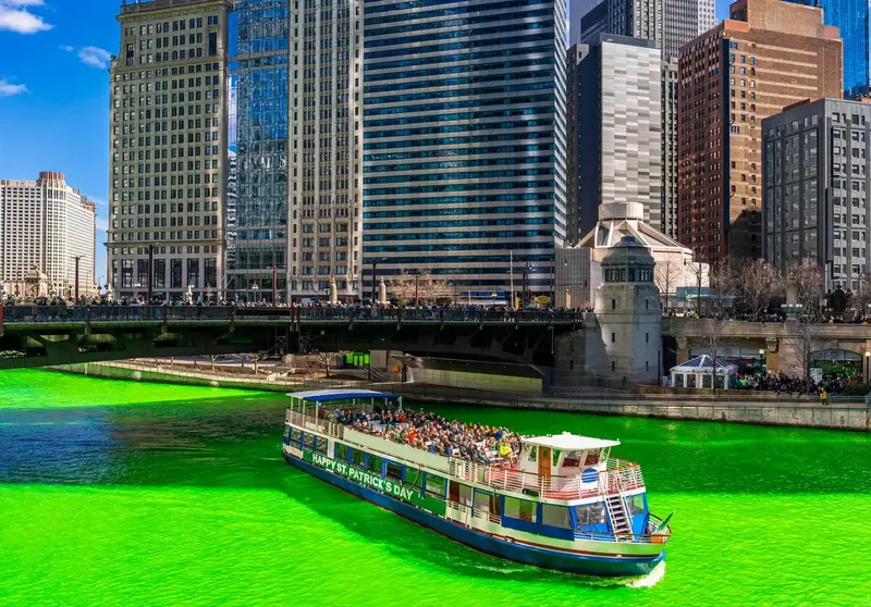 Chicago river dyed green with a festive boat for St. Patrick's.