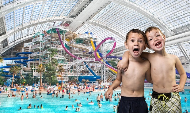 Joyful kids with indoor water slides and pool.