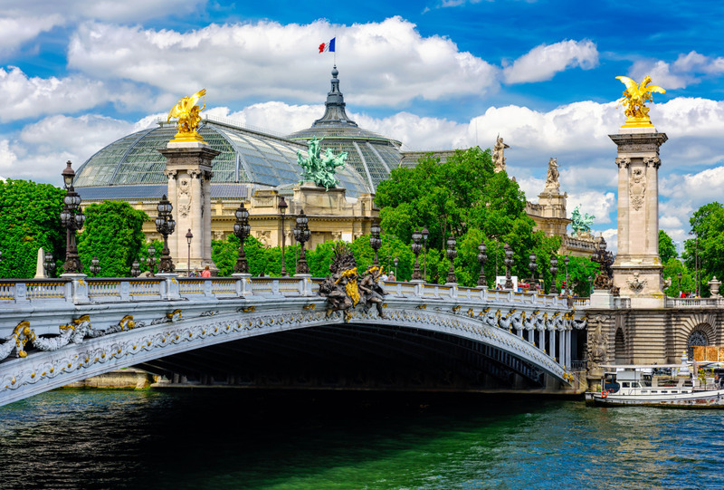 Alexandre III Bridge with golden statues over the Seine.