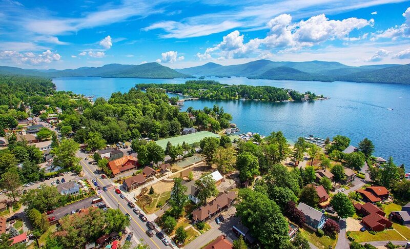Aerial view of Lake George, showcasing its crystal-clear waters and sandy beaches