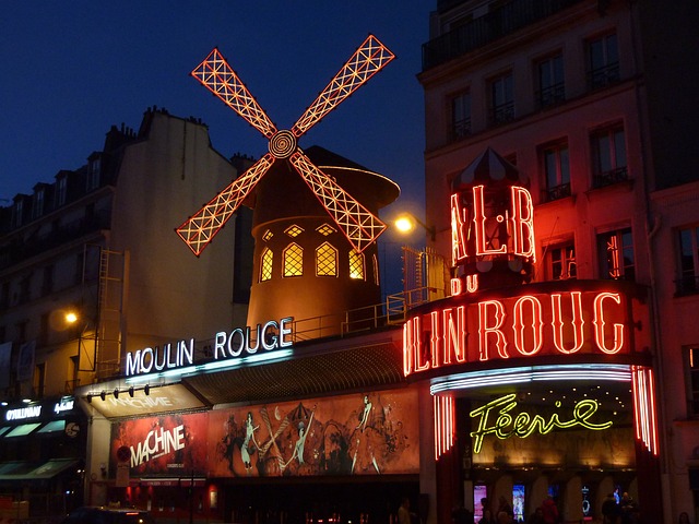 Moulin Rouge's red windmill at night.
