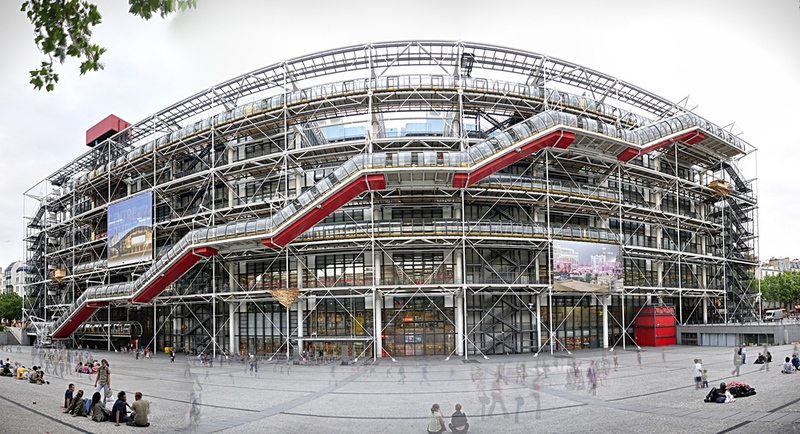 Image of the Centre Pompidou in Paris, showcasing its distinctive industrial-style exterior with transparent escalators and red, blue, and yellow pipes, a must-visit destination for contemporary art enthusiasts.