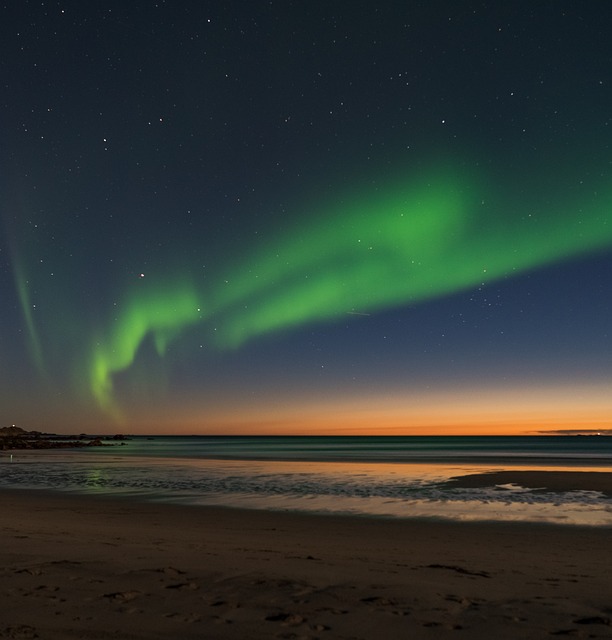 Northern Lights (Aurora Borealis) dance across the night sky