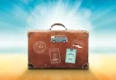 Vintage suitcase with travel stickers symbolizing summer trips and Paris travel tips.