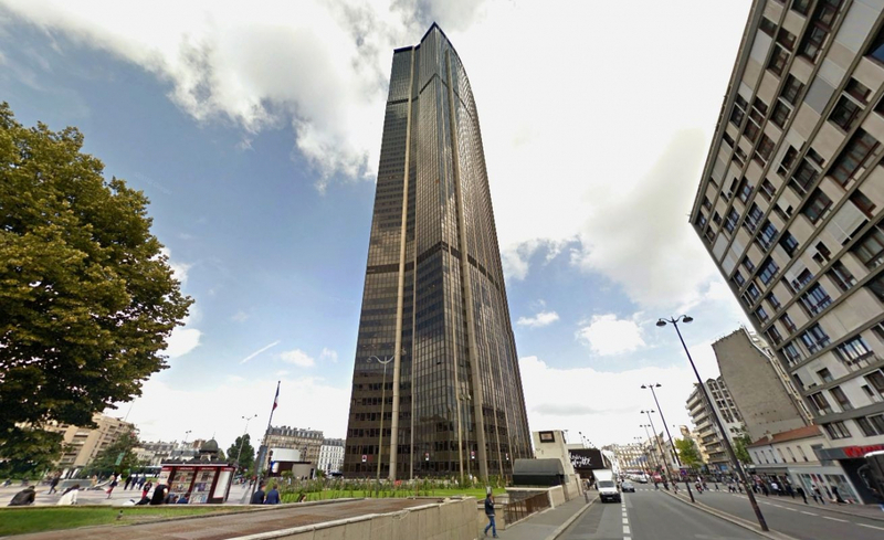 Montparnasse Tower rising above Paris on a clear day.