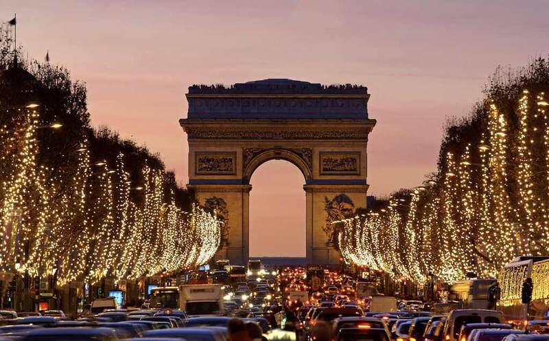 Twilight descends on the Champs-Élysées leading to the Arc de Triomphe.